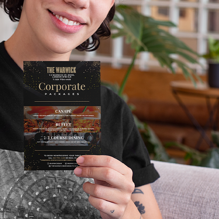 a6 printed leaflet held in left hand