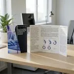 open gate folded leaflet in office