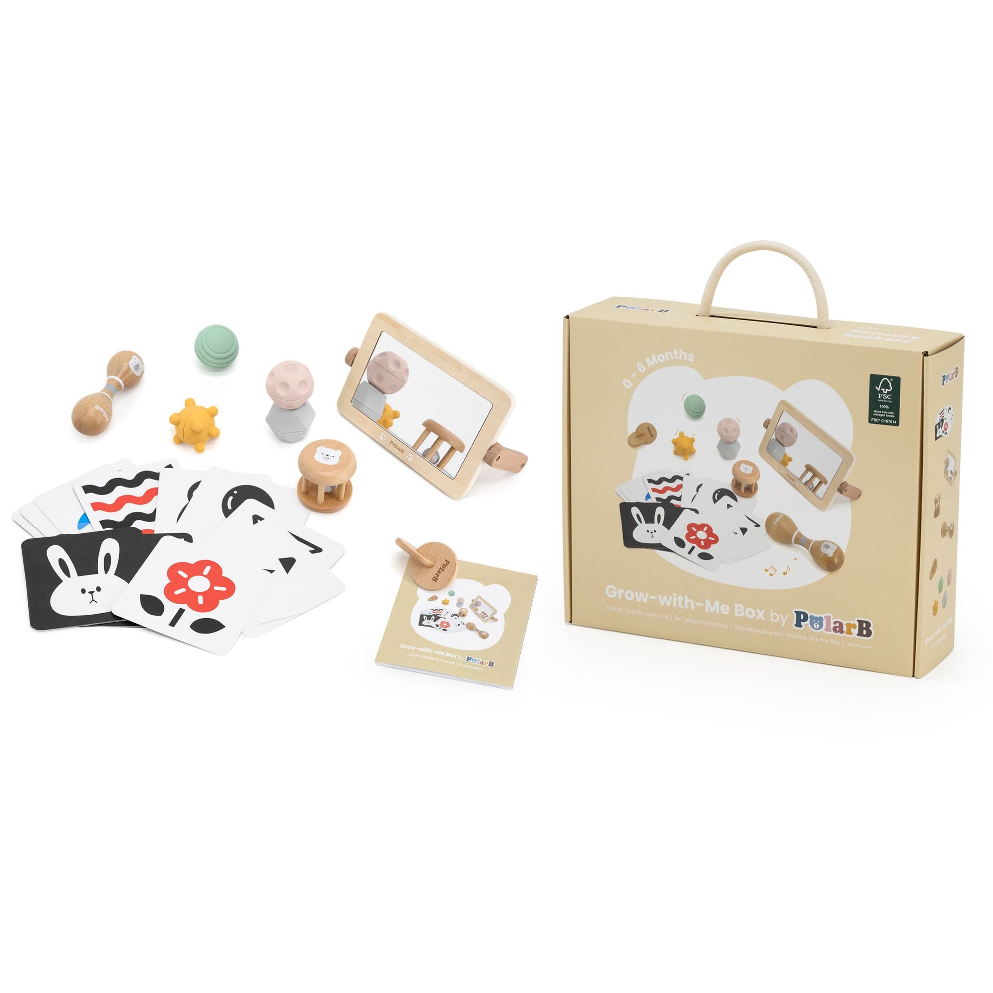 Komplette Montessori Spielbox für Babys von 0-6 Monaten von supermami.ch mit Holzrassel, Kontrastkarten und Silikonbällen.