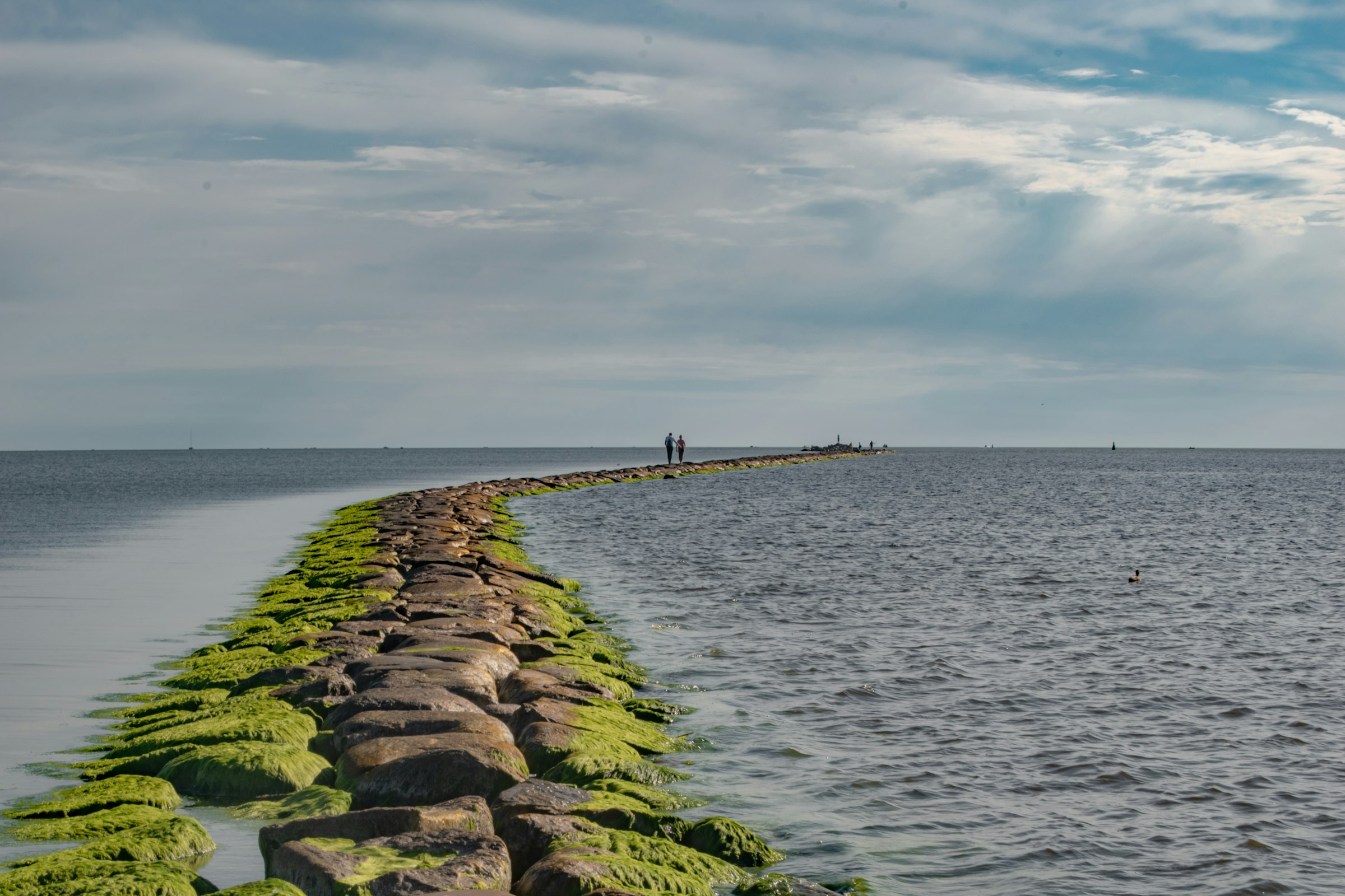 Stone breakwater stretching into the sea