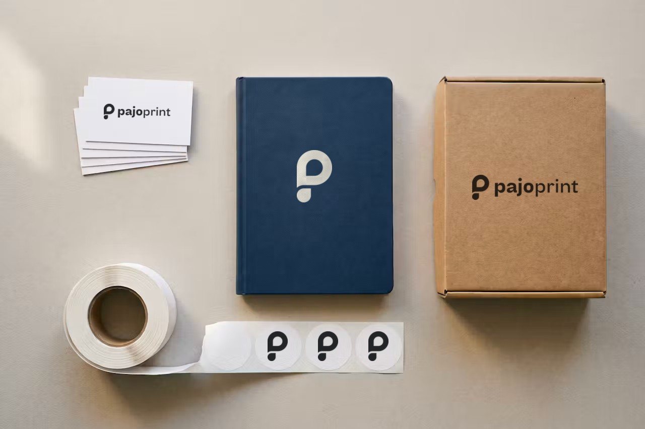 Business cards, notebook, box and label roll with the Pajoprint logo